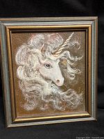 Front view of framed unicorn painting