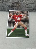 Front of postcard showing Joe Montana artwork