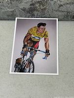 Front view showing color illustration of Lance Armstrong on bicycle