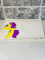 Full view of animation cel showing pony and frog on registration paper