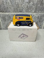 Left front view of van on box showing graphics