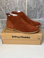 Side view of both boots on box