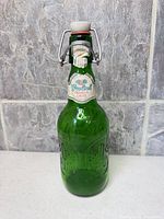 Front view of green glass Grolsch swing-top bottle