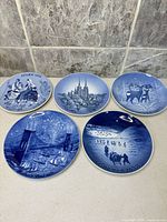 Group shot of five blue porcelain plates