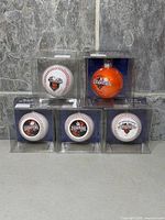 All five ornaments in display cubes