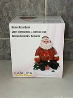 Front of box showing Santa lamp image and branding