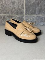 Side view showing both shoes, color, heel style