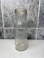 Full front view showing embossed Standard Oil logo and bottle form