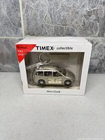 Front of boxed Timex collectible car mini-clock showing product through window and key ring