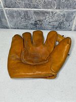 Front palm view showing Goldsmith stamp and overall glove condition