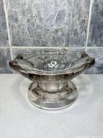 Side view showing overall shape and pedestal base