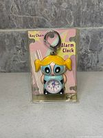 Front view of sealed Bubbles key chain alarm clock in blister pack
