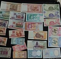 Overview of first grouping of loose world banknotes