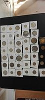 Overview of entire lot showing coins in 2x2 flips plus loose pieces