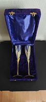 Pair of flutes in open velvet case