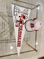 Pennant and cap on table, full view