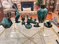 Group shot of all nine Blue Mountain Pottery pieces on glass table