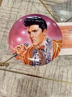 Front angled view showing Elvis portrait and gold accents