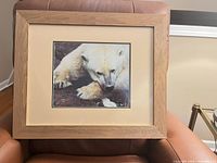 Front view of the framed polar bear photograph showing full frame and mat