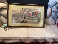 Full view of framed gladiator print on hearth