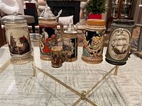 All six steins grouped on glass table