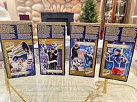 Four different box fronts showing Gretzky card panels (Oilers, Kings, Blues, Rangers)