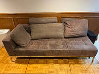 Front view of chaise lounge showing upholstery, cushions, chrome legs