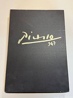 Front cover of one volume showing title script