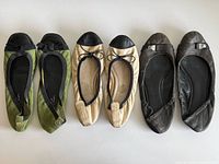 All three pairs of ballet flats laid out side by side showing uppers