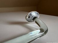 Close-up of left metal mounting plate with paint residue