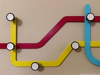 Front view of Umbra Subway coat hanger showing colours and hooks