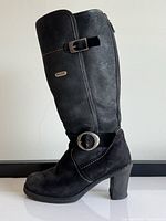 Left boot side profile showing suede/leather construction, ankle strap, Pajar badge, heel style