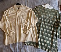 Front view of both blouses laid flat