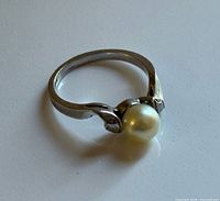 side view of ring showcasing pearl and band
