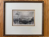 Front view of framed etching showing full frame, mat and glazing