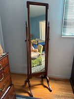 Full view of oak cheval mirror on stand