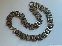 Entire necklace laid out showing length, link style and clasp