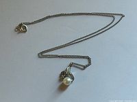 Full necklace laid out showing chain, pendant, clasp
