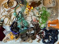 Overall view of mixed costume jewelry on plate