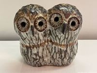 Front view showing two owl faces, glaze texture and coloration