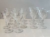 Front view of all 17 crystal glasses showing two heights