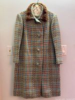Front view of houndstooth coat with mink collar