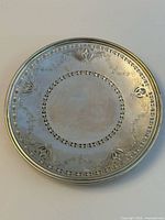 Full overhead view of engraved sterling silver round tray