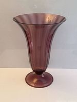 Full view of purple Murano glass vase showing shape and color