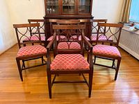 Front group view of all eight walnut dining chairs
