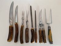 Group image of all eight antler-handled utensils