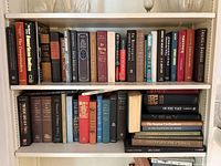 Two shelves filled with history and geography hardcovers