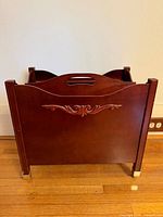 Front view showing carved panel and overall finish