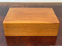 Closed humidor top view showing walnut grain