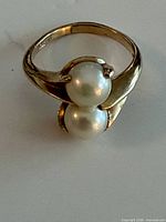 Top view of 10k gold ring featuring two cultured pearls